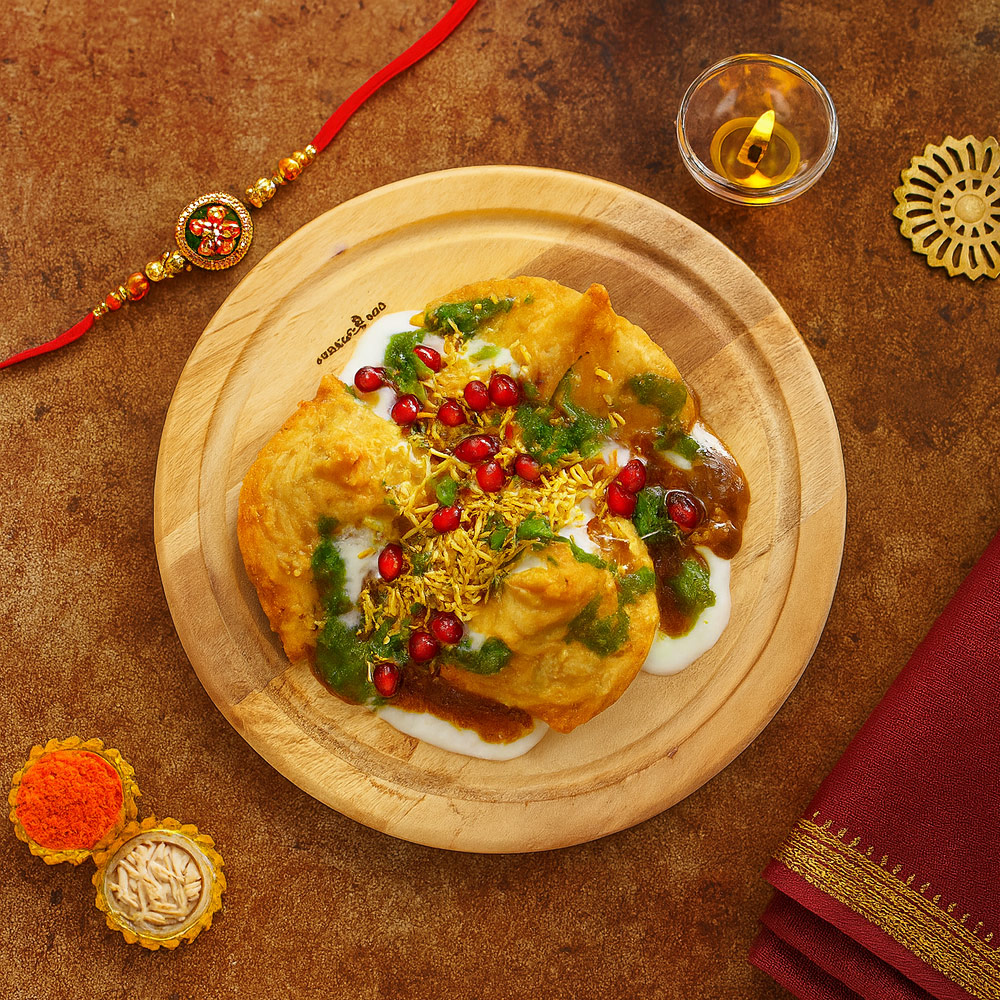 Samosa Chaat on Round Wooden Plate